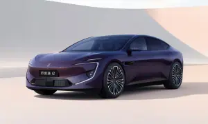 A sleek, dark purple electric sedan with distinctive LED headlights and a modern design.