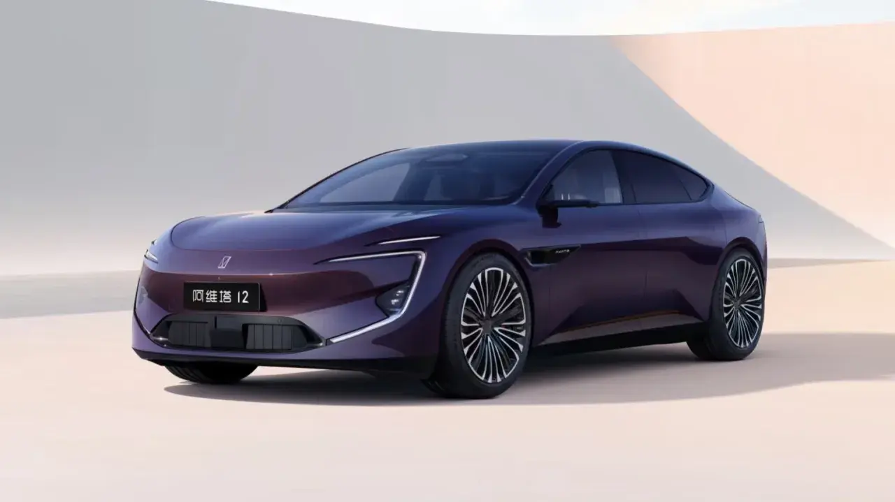 A sleek, dark purple electric sedan with distinctive LED headlights and a modern design.
